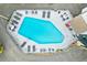 Aerial view of community pool with lounge chairs and tables at 1500 Cenith Dr. # C-103, North Myrtle Beach, SC 29582