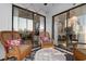 Inviting sunroom with wicker furniture, sliding glass doors, and natural light at 1500 Cenith Dr. # C-103, North Myrtle Beach, SC 29582