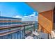 Relax on this balcony offering views of the city, palm trees, and blue sky at 1501 S Ocean Blvd. # 1406, Myrtle Beach, SC 29577