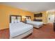 Bright hotel bedroom with two beds and a convenient kitchenette area at 1501 S Ocean Blvd. # 1406, Myrtle Beach, SC 29577
