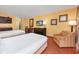 Spacious bedroom with kitchenette, two beds, and a cozy seating area at 1501 S Ocean Blvd. # 1406, Myrtle Beach, SC 29577