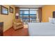 Cozy bedroom interior with a private balcony and comfortable chair for relaxation at 1501 S Ocean Blvd. # 1406, Myrtle Beach, SC 29577