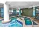 Relax in the hot tub area with blue mosaic tiles and a tranquil plant wall at 1501 S Ocean Blvd. # 1406, Myrtle Beach, SC 29577