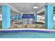 The indoor pool area features decorative tile work and a unique fountain feature at 1501 S Ocean Blvd. # 1406, Myrtle Beach, SC 29577