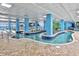 Indoor lazy river with blue columns, brick decking, and views of the ocean at 1501 S Ocean Blvd. # 1406, Myrtle Beach, SC 29577