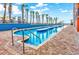 Outdoor pool with brick decking and palm trees at 1501 S Ocean Blvd. # 1406, Myrtle Beach, SC 29577