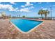 Outdoor pool with brick decking and lounge chairs overlooking the ocean at 1501 S Ocean Blvd. # 1406, Myrtle Beach, SC 29577