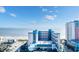 Stunning exterior shot of a multi-story building next to the beach, with a parking lot and connected skyway at 1501 S Ocean Blvd. # 633, Myrtle Beach, SC 29577