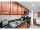 Charming kitchen featuring ample cabinet space, granite countertops, and black appliances at 1501 S Ocean Blvd. # 633, Myrtle Beach, SC 29577