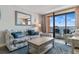 Cozy living room featuring a large window with balcony access and ocean views at 1501 S Ocean Blvd. # 633, Myrtle Beach, SC 29577