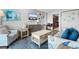 Cozy living room with ocean-themed decor, comfortable seating, and a view of the kitchen at 1501 S Ocean Blvd. # 633, Myrtle Beach, SC 29577