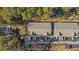 Aerial view of the community featuring multi-Gathering buildings, ample parking, and mature trees at 160 Lazy Willow Ln. # 204, Myrtle Beach, SC 29577
