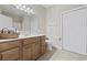 Bright bathroom with white counter and sink, wood vanity, tile floor and a linen closet at 160 Lazy Willow Ln. # 204, Myrtle Beach, SC 29577