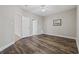Bedroom with wood-look floors and white doors to hall, bath and closet at 160 Lazy Willow Ln. # 204, Myrtle Beach, SC 29577