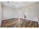 Bedroom with wood-look floors, white doors to hall and bath, and ceiling fan at 160 Lazy Willow Ln. # 204, Myrtle Beach, SC 29577