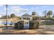 Picturesque gazebo surrounded by lush greenery, offering a peaceful retreat by the lake at 160 Lazy Willow Ln. # 204, Myrtle Beach, SC 29577