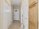 Inviting hallway features tiled floors, neutral walls, and ample closet space at 160 Lazy Willow Ln. # 204, Myrtle Beach, SC 29577