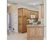 Eat-in kitchen with granite countertops, natural wood cabinets, and white appliances at 160 Lazy Willow Ln. # 204, Myrtle Beach, SC 29577