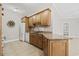 Open kitchen design with modern white appliances, granite counters, and wood cabinets at 160 Lazy Willow Ln. # 204, Myrtle Beach, SC 29577