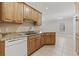 Bright kitchen with granite counters, wooden cabinets, and white appliances at 160 Lazy Willow Ln. # 204, Myrtle Beach, SC 29577