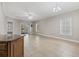 Open living area with tiled floor, fan and sliding glass doors leading to patio at 160 Lazy Willow Ln. # 204, Myrtle Beach, SC 29577