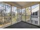 Relaxing screened porch with a serene wooded view, providing an inviting outdoor living space at 160 Lazy Willow Ln. # 204, Myrtle Beach, SC 29577
