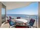 Condo balcony features a table with chairs and a great ocean view at 1625 S Ocean Blvd. # 1004, North Myrtle Beach, SC 29582