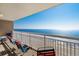 Condo balcony features chairs and a spectacular ocean view at 1625 S Ocean Blvd. # 1004, North Myrtle Beach, SC 29582