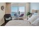 Inviting bedroom with a queen-sized bed and a view of the ocean from the private balcony at 1625 S Ocean Blvd. # 1004, North Myrtle Beach, SC 29582