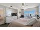 Bright bedroom featuring a queen bed, dresser, and a sliding glass door leading to the balcony at 1625 S Ocean Blvd. # 1004, North Myrtle Beach, SC 29582