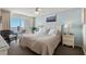 Relaxing bedroom with a queen-sized bed and access to a private balcony overlooking the ocean at 1625 S Ocean Blvd. # 1004, North Myrtle Beach, SC 29582