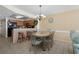 Dining room featuring an elegant dining table with seating for six, and a view of the kitchen bar at 1625 S Ocean Blvd. # 1004, North Myrtle Beach, SC 29582