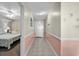 Hallway leading into the condo features tile flooring and view of the bedroom to the left at 1625 S Ocean Blvd. # 1004, North Myrtle Beach, SC 29582