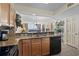 Open kitchen design overlooking the living area and ocean views, with bar height counter at 1625 S Ocean Blvd. # 1004, North Myrtle Beach, SC 29582