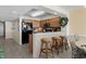 Well-equipped kitchen featuring wooden cabinetry and a breakfast bar with stool seating at 1625 S Ocean Blvd. # 1004, North Myrtle Beach, SC 29582