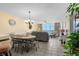 Open-concept living and dining area with tile floors, ocean view, and comfortable seating at 1625 S Ocean Blvd. # 1004, North Myrtle Beach, SC 29582
