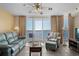Cozy living room featuring comfortable seating and a balcony with breathtaking ocean views at 1625 S Ocean Blvd. # 1004, North Myrtle Beach, SC 29582