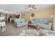 Inviting living room featuring tile floors, and comfortable blue couches near the adjacent kitchen at 1625 S Ocean Blvd. # 1004, North Myrtle Beach, SC 29582