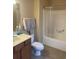 Small bathroom featuring a vanity, toilet, and a shower/tub combination with clear shower curtain at 1719 Low Country Pl. # B, Myrtle Beach, SC 29577