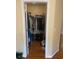 Walk-in closet with clothes hanging on rods and items on the floor at 1719 Low Country Pl. # B, Myrtle Beach, SC 29577