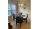 Bright dining area featuring a glass table, tile flooring, and natural light from the window at 1719 Low Country Pl. # B, Myrtle Beach, SC 29577
