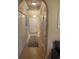 Inviting hallway with tiled floor, coat closet, and stairs leading to upper level at 1719 Low Country Pl. # B, Myrtle Beach, SC 29577