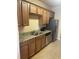Efficient kitchen featuring stainless steel appliances, granite countertops, and ample cabinet space at 1719 Low Country Pl. # B, Myrtle Beach, SC 29577