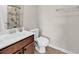 Cozy bathroom features a single sink vanity with warm wood cabinets and a seashell themed shower curtain at 1749 Culbertson Ave. # 1749, Myrtle Beach, SC 29577