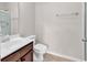 Bathroom with a dark wood vanity, brushed nickel faucet, and a white toilet at 1749 Culbertson Ave. # 1749, Myrtle Beach, SC 29577