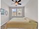 Bright bedroom with wood-look floors, ceiling fan, and great natural light at 1749 Culbertson Ave. # 1749, Myrtle Beach, SC 29577