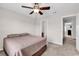 Bedroom with a ceiling fan and views of an ensuite bathroom and hallway at 1749 Culbertson Ave. # 1749, Myrtle Beach, SC 29577