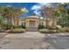 A welcoming community clubhouse with a well-maintained garden and palm trees at 1749 Culbertson Ave. # 1749, Myrtle Beach, SC 29577