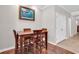 Dining room with a wooden table set, hardwood floors, and neutral wall paint at 1749 Culbertson Ave. # 1749, Myrtle Beach, SC 29577