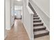 Welcoming tiled foyer with a carpeted staircase and an entry to the living room at 1749 Culbertson Ave. # 1749, Myrtle Beach, SC 29577